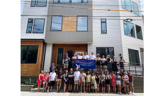 Photo credit: Somerville Community Land Trust board and volunteers in front of 7 Summer Street. Photo courtesy of the Somerville Community Land Trust.
